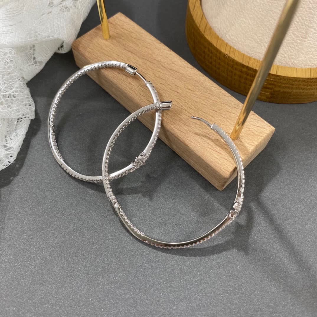APM Monaco Silver Hoop Earrings with Diamond Star